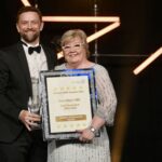 Rob Cooper, Chief Executive presents Ann Marr OBE with her Lifetime Achievement Award