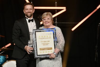 Rob Cooper, Chief Executive presents Ann Marr OBE with her Lifetime Achievement Award