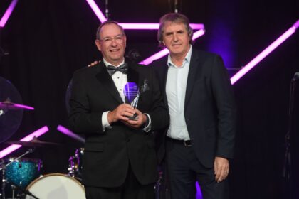 Rev. Martin Abrams MBE with Mayor of the Liverpool City Region, Steve Rotheram, and the Special Recognition Award at the Mersey and West Lancashire Teaching Hospitals NHS Trust staff awards
