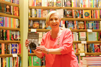 Sharon from Waterstones bookshop in Southport with a copy of the new novel The Shankly Conspiracy by John Keith. Photo by Bertie Cunningham Southport BID