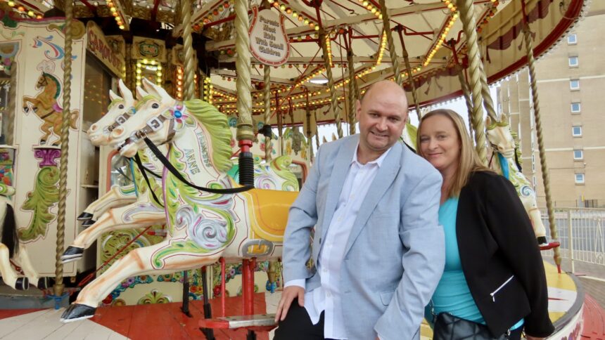 Eric and Louise Morris have celebrated their first wedding anniversary in Southport. The couple enjoyed their first date outside Silcock's Funland, where they later had wedding pictures taken. Photo by Andrew Brown Stand Up For Southport