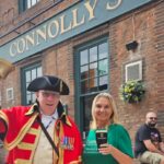Connolly's Irish pub in Southport has reopened. Southport Town Crier Kevin Ruane with owner Julie Goodwin