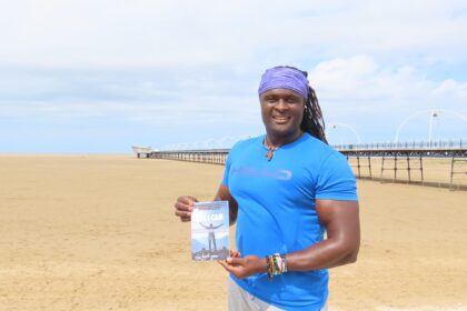 Sam Jalloh with his book Yes I Can. Photo by Andrew Brown Stand Up For Southport