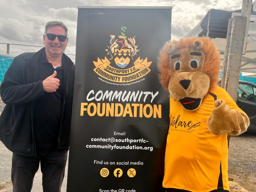 Scott Blundell and Sandy the Lion at the Southport FC Comnmunity Foundation. Photo by Andrew Brown Stand Up For Southport