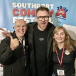 Jason Byrne (centre) at Southport Comedy Festival 2025 at Victoria Park in Southport with festival directors Brendan Riley (left) and Val Brady (right). Photo by Andrew Brown Stand Up For Southport