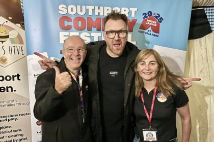 Jason Byrne (centre) at Southport Comedy Festival 2025 at Victoria Park in Southport with festival directors Brendan Riley (left) and Val Brady (right). Photo by Andrew Brown Stand Up For Southport