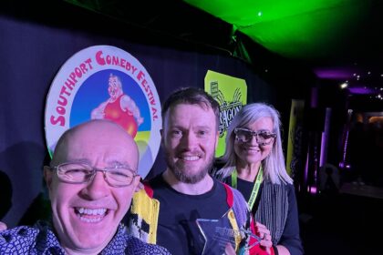 The Southport New Comedian of The Year competition sponsored by Dragon Soop. Winner Rich McCulloch (centre) with festival director Brendan Riley (left) and Isabelle Kent (Dragon Soop, right)