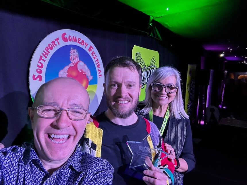 The Southport New Comedian of The Year competition sponsored by Dragon Soop. Winner Rich McCulloch (centre) with festival director Brendan Riley (left) and Isabelle Kent (Dragon Soop, right)