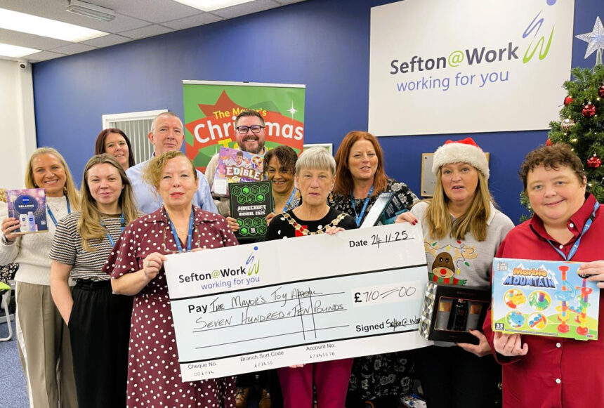 Sefton@Work Manager Linda Patterson and Sefton Mayor Cllr June Burns and members of the Bootle Strand Sefton@Work team launch the Mayor Of Sefton Toy Appeal