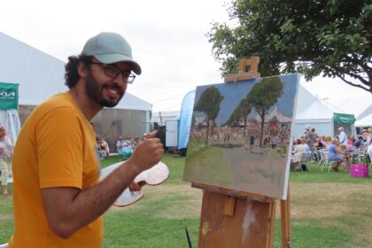 Artist Nasr Eddine Benbrahim, known under the name Nasro Mo, has been carrying out his Southport plein air painting series with scenes across the town and beyond. At Southport Flower Show. Photo by Andrew Brown Stand Up For Southport