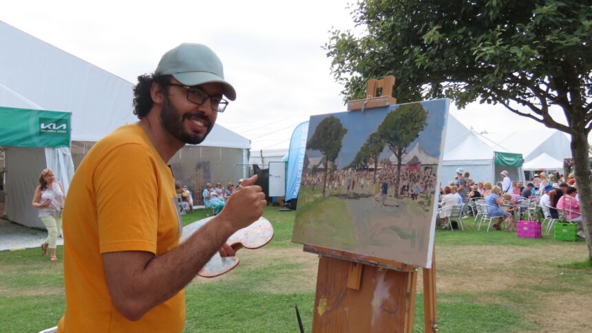 Artist Nasr Eddine Benbrahim, known under the name Nasro Mo, has been carrying out his Southport plein air painting series with scenes across the town and beyond. At Southport Flower Show. Photo by Andrew Brown Stand Up For Southport