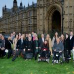 Phab attendees, supporters and staff posing together outside of the House of Lords