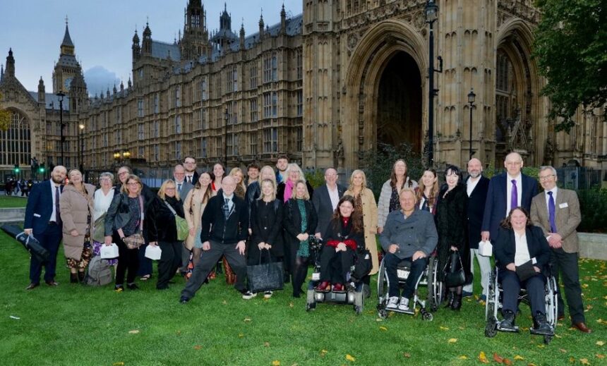Phab attendees, supporters and staff posing together outside of the House of Lords