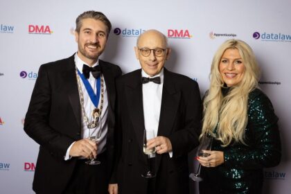 Guests enjoy the 2025 Southport and Ormskirk Law Society Annual Dinner at Hillside Golf Club in Southport. President of Southport & Ormskirk Law Society Gererad Horton, Partner at Leigh Day (left) , with his wife, Kirsty Thomas-Horton, the Head of Business Development at Fletchers Group (right), and Law Society Toastmaster Michael Braham (centre). Photo by Datalaw