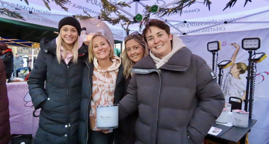 Jennie Stancombe and the Elsie's Story team with the Elsie's Story candle