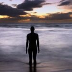 An exhibition has opened at The Atkinson in Southport dedicated to photographs of Crosby beach’s Iron Men, taken over two decades by photographer Ron Davies