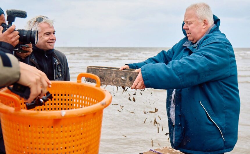 Southport fisherman Kevin Peet is filmed for a German TV documentary. Photo by George O'Connor