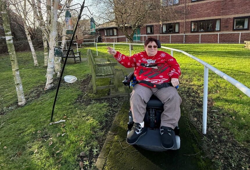 Community Link Foundation has helped transform the life of Elaine Donn, a woman with cerebral palsy, by funding a specialist powered wheelchair
