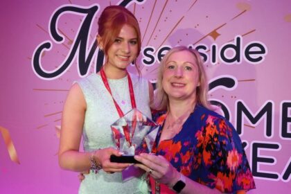 Marion Reilly from Rathbones presenting 2025 MWOTY (Merseyside Women of The Year) entrepreneur winner Katie Bowater with her award at last years ceremony. Photo by Ray Farley)