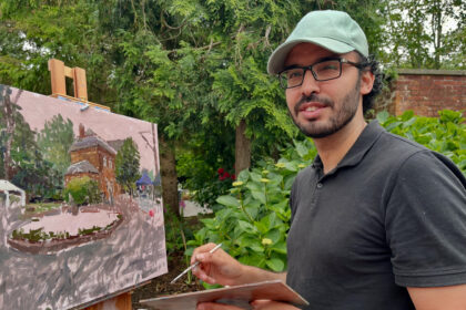 Southport artist Nasro Mo painting plein air at the Botanic Gardens in Churchtown in Southport. Photo by Andrew Brown Stand Up For Southport