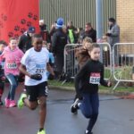 Competitors in the Pups Race at the Mad Dog 10K run in Southport. Photo by Andrew Brown Stand Up For Southport