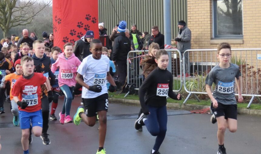 Competitors in the Pups Race at the Mad Dog 10K run in Southport. Photo by Andrew Brown Stand Up For Southport