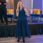 Artist Clare Wright was delighted to see her When Bella Met Bertie artwork - signed by Liverpool FC legend Sir Kenny Dalglish - raise £700 for Queenscourt Hospice at this years International Womens Day celebration in Southport. Photo by MAF Photography