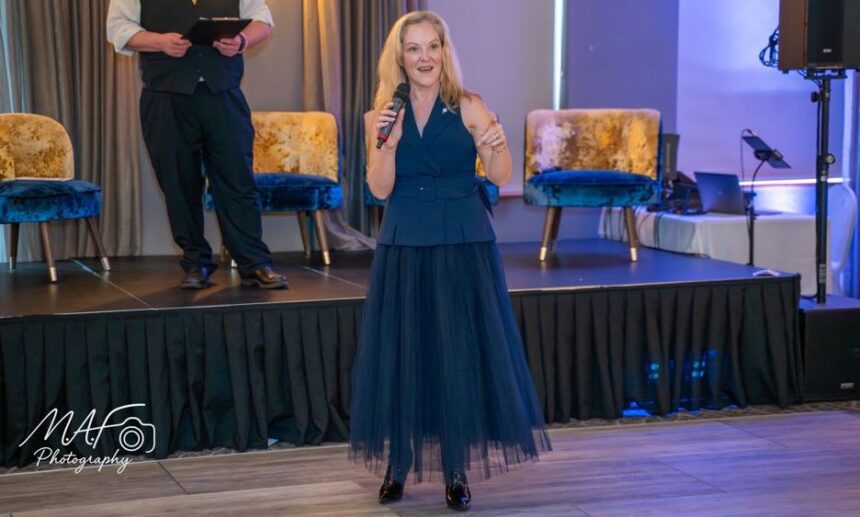 Artist Clare Wright was delighted to see her When Bella Met Bertie artwork - signed by Liverpool FC legend Sir Kenny Dalglish - raise £700 for Queenscourt Hospice at this years International Womens Day celebration in Southport. Photo by MAF Photography