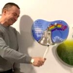 Patient Paul Dooley ringing the end of treatment bell at The Clatterbridge Cancer Centre