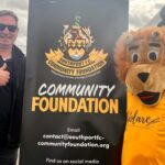 Scott Blundell and Sandy the Lion at the Southport FC Comnmunity Foundation. Photo by Andrew Brown Stand Up For Southport