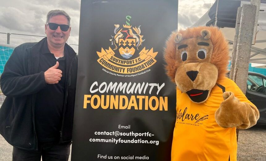 Scott Blundell and Sandy the Lion at the Southport FC Comnmunity Foundation. Photo by Andrew Brown Stand Up For Southport