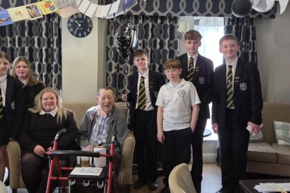 Stan Woolley at Ivy Gate Lodge Care Home in Southport is celebrating his 100th birthday. Students from Stanley High School in Southport called in to wish him happy birthday