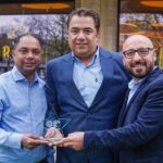Accepting the award are owners Alvino Cardozo (left) and Ranjeet Singh (right) with chef Micky Chhabra (centre). Photo by Bertie Cunningham Southport BID