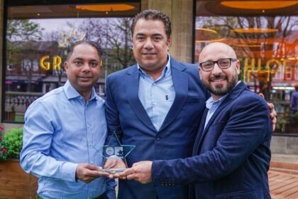 Accepting the award are owners Alvino Cardozo (left) and Ranjeet Singh (right) with chef Micky Chhabra (centre). Photo by Bertie Cunningham Southport BID