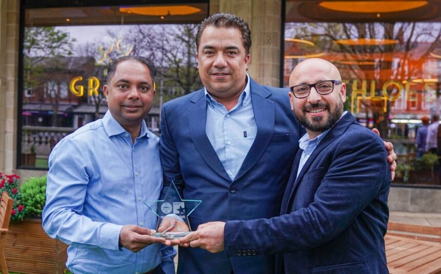 Accepting the award are owners Alvino Cardozo (left) and Ranjeet Singh (right) with chef Micky Chhabra (centre). Photo by Bertie Cunningham Southport BID
