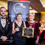 Dr Karen Groves MBE (centre) the founder of Queenscourt Hospice with the Main Grand Pride Of Sefton Award sponsored by Mikhail Hotel And Leisure Group. She is pictured alongside Merseyside Lord Lieutenant Peter Oliver OBE (left) and Mayor of Sefton Cllr June Burns (right). Photo by Kevin Brown Photography