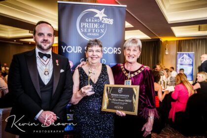 Dr Karen Groves MBE (centre) the founder of Queenscourt Hospice with the Main Grand Pride Of Sefton Award sponsored by Mikhail Hotel And Leisure Group. She is pictured alongside Merseyside Lord Lieutenant Peter Oliver OBE (left) and Mayor of Sefton Cllr June Burns (right). Photo by Kevin Brown Photography
