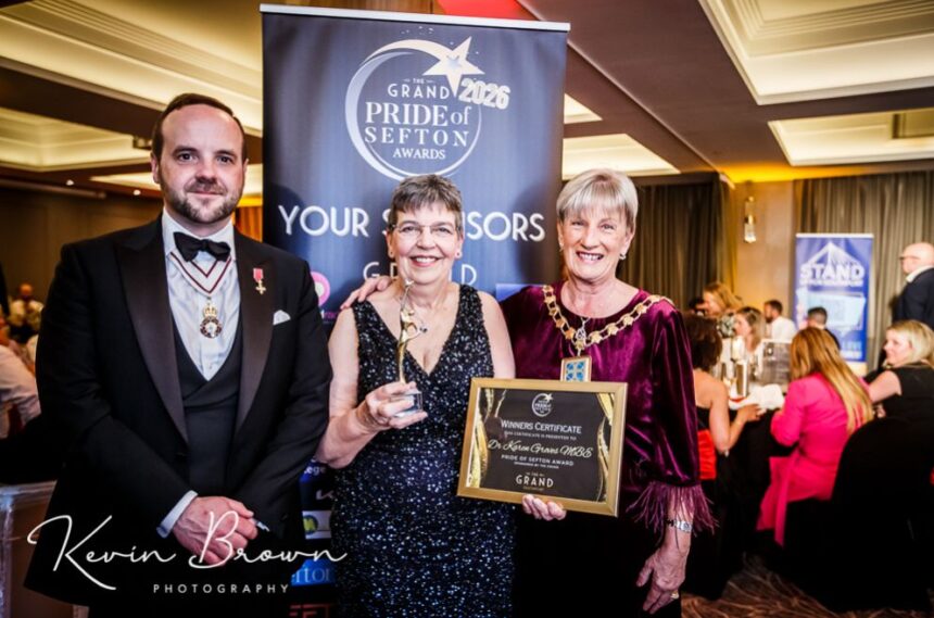 Dr Karen Groves MBE (centre) the founder of Queenscourt Hospice with the Main Grand Pride Of Sefton Award sponsored by Mikhail Hotel And Leisure Group. She is pictured alongside Merseyside Lord Lieutenant Peter Oliver OBE (left) and Mayor of Sefton Cllr June Burns (right). Photo by Kevin Brown Photography