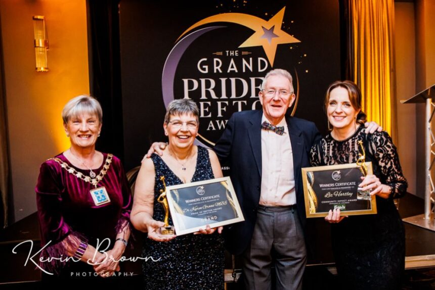 Dr Karen Groves MBE (second left) the founder of Queenscourt Hospice with the Main Grand Pride Of Sefton Award sponsored by Mikhail Hotel And Leisure Group. She is pictured alongside Mayor of Seftohn Cllr June Burns (left); husband John Moffat (third left); and Queenscourt Fundraising manager Liz Hartley (right) who won the Community Impact Award. Photo by Kevin Brown Photography