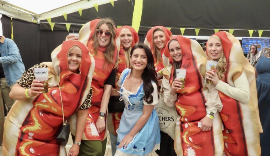 Hundreds of people enjoyed the first Southport Sausage and Cider Festival at Victoria Park in Southport. Kelly Stevens and friends came dressed as hotdogs, pictured with Kelly Bond. Photo by Andrew Brown Stand Up For Southport