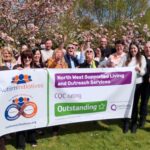 Staff celebrating their outstanding rating at WeGrow social enterprise  an outdoor market garden run by Autism Initiatives