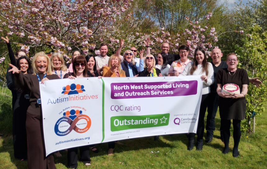Staff celebrating their outstanding rating at WeGrow social enterprise  an outdoor market garden run by Autism Initiatives