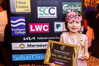Holly Keira Barnes was recognised with a Sefton Child Of Courage Award at the 2026 Grand Pride Of Sefton Awards at The Grand in Southport. Holly was presented with her Sefton Child Of Courage Award by Stephen Grayson from category sponsor Cooper Parry accountants. Photo by Kevin Brown Photography