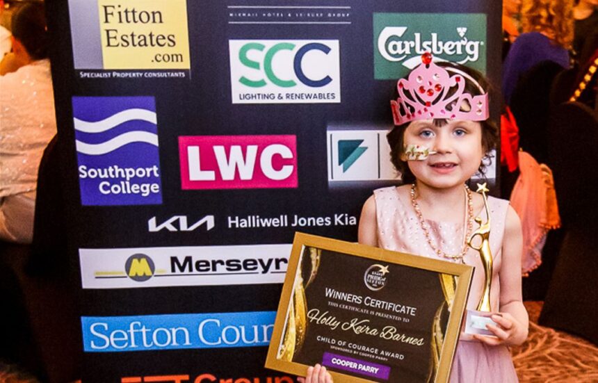 Holly Keira Barnes was recognised with a Sefton Child Of Courage Award at the 2026 Grand Pride Of Sefton Awards at The Grand in Southport. Holly was presented with her Sefton Child Of Courage Award by Stephen Grayson from category sponsor Cooper Parry accountants. Photo by Kevin Brown Photography