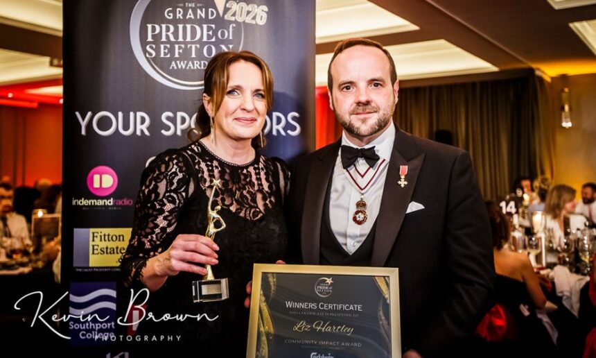 Queenscourt Hospice Fundraising Manager Liz Hartley has won the Sefton Community Impact Award at the 2026 Grand Pride Of Sefton Awards at The Grand in Southport. She was presented with her award by Merseyside Lord Lieutenant Peter Oliver OBE. Photo by Kevin Brown Photography