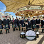 The Liverpool Scottish Regimental Pipes and Drums next to Silcock's Carousel in Southport, where they performed during Southport Armed Forces Day. Photo by Andrew Brown Stand Up For Southport