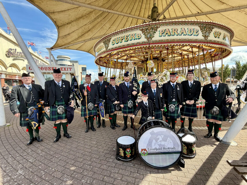 The Liverpool Scottish Regimental Pipes and Drums next to Silcock's Carousel in Southport, where they performed during Southport Armed Forces Day. Photo by Andrew Brown Stand Up For Southport