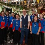 People gathered to enioy The Great Big Green Lunch at Southport Market. Photo by The Hearth CIC