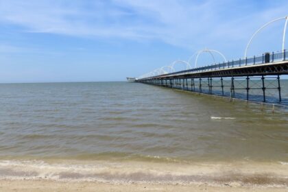 A scenic picture of Southport Beach and Southport Pier. Photo by Andrew Brown Stand Up For Southport