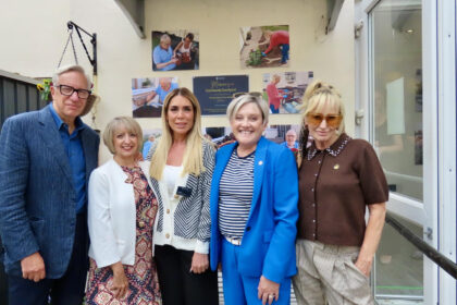 A garden created from a family's simple act of kindness has officially opened at Dovehaven House in Southport. Marian's family, Ashley Dalton MP, & Home Manager Laura Cowen. Photo by Andrew Brown Stand Up For Southport
